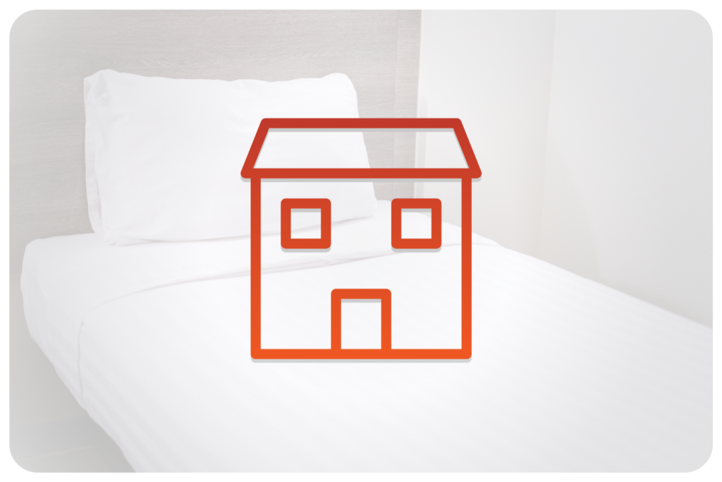 photo of a bed with white sheets